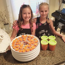 Maggie & Hannah making dehydrated apricots & freezer jam