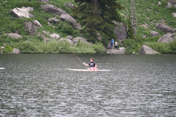 Merrill fishing from his paddleboard