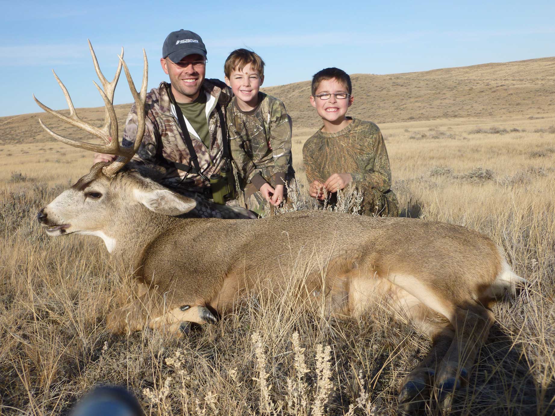 Jake Gertsch and his boys and their Buck.