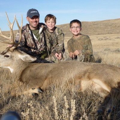 Jake Gertsch and his boys and their Buck.